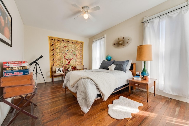 bedroom with a ceiling fan and hardwood / wood-style floors