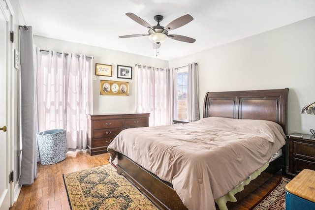 bedroom with light wood-type flooring and ceiling fan