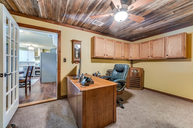 office space featuring wood ceiling, a ceiling fan, visible vents, baseboards, and carpet