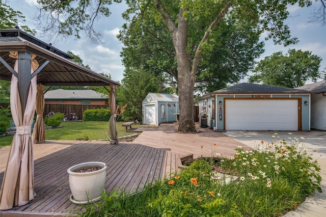 107 S Graves St, Mckinney, TX 75069 - deck featuring a gazebo, a garage, and driveway