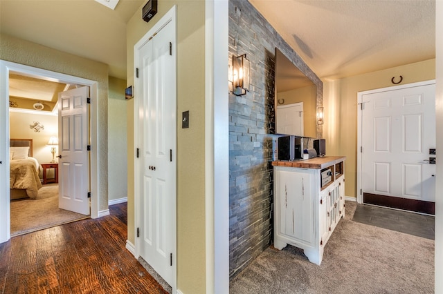 107 S Graves St, Mckinney, TX 75069 - foyer entrance featuring dark colored carpet, baseboards, and a textured ceiling