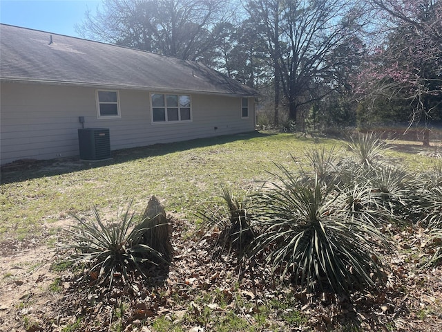 view of yard featuring central air condition unit