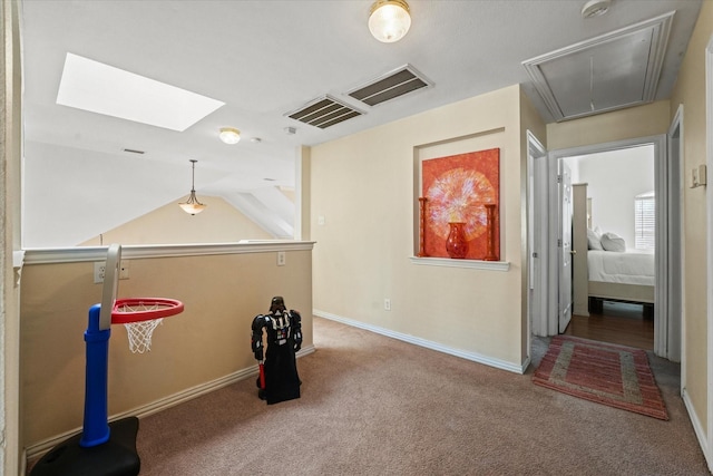 game room with baseboards, visible vents, attic access, and carpet