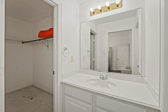 bathroom featuring vanity and concrete floors