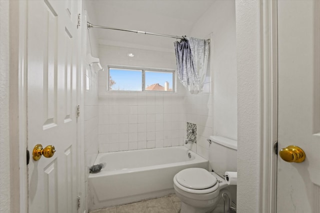 bathroom with tile patterned flooring, shower / tub combination, and toilet