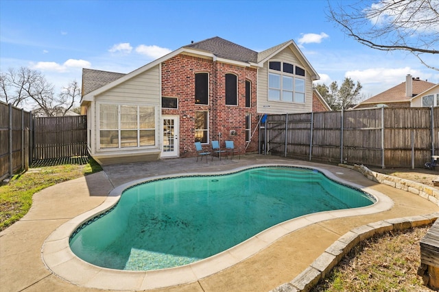 view of pool featuring a patio area, a fenced backyard, and a fenced in pool