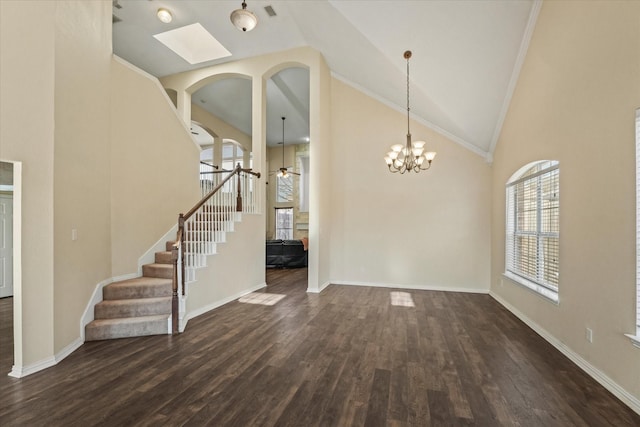 interior space featuring stairway, a ceiling fan, dark wood-style floors, baseboards, and high vaulted ceiling