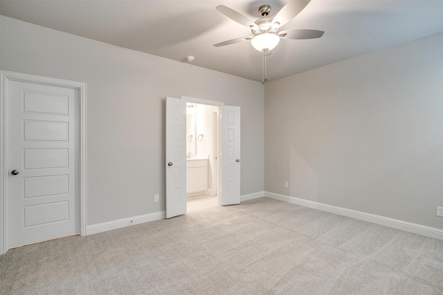 unfurnished bedroom with light carpet and baseboards