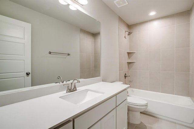 bathroom featuring tile patterned flooring, toilet, vanity, bathing tub / shower combination, and visible vents