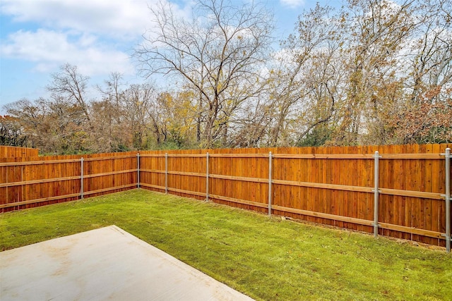 view of yard featuring a fenced backyard and a patio