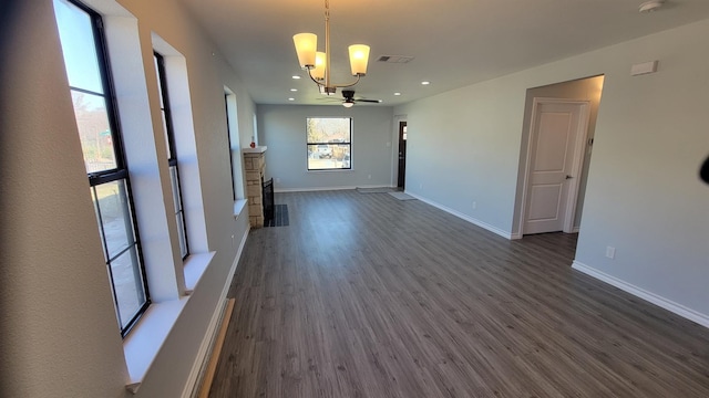 1227 Harlandale Ave, Dallas, TX 75216 - interior space featuring dark wood-style flooring, visible vents, a fireplace, and baseboards