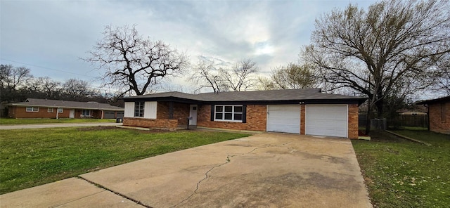 single story home featuring a garage, concrete driveway, brick siding, and a front lawn