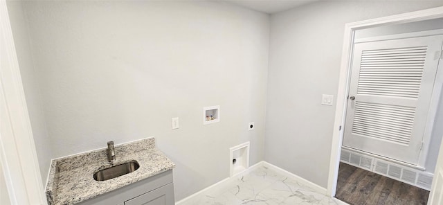 clothes washing area featuring washer hookup, marble finish floor, hookup for an electric dryer, a sink, and baseboards