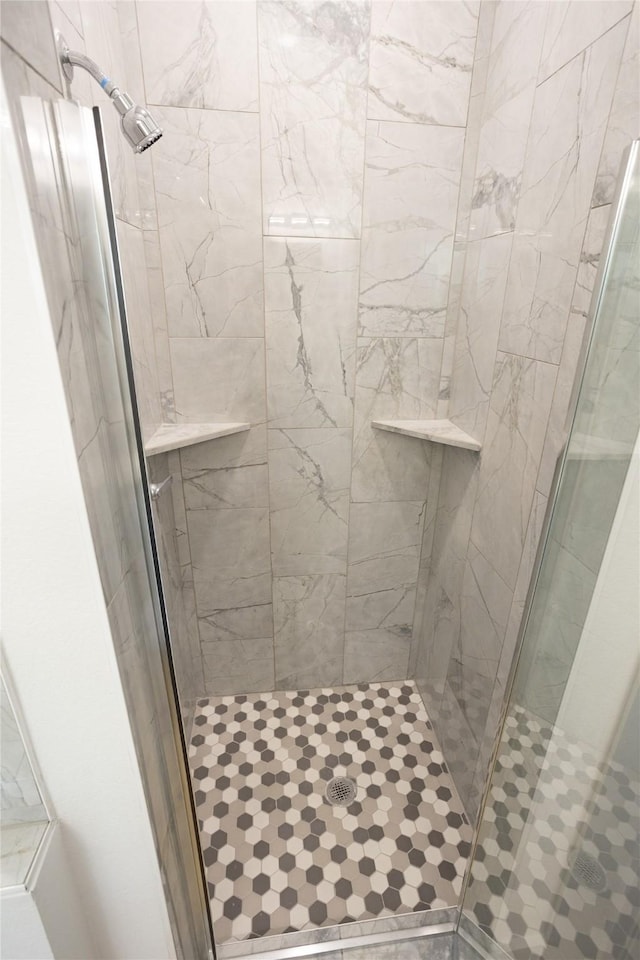 bathroom featuring a stall shower