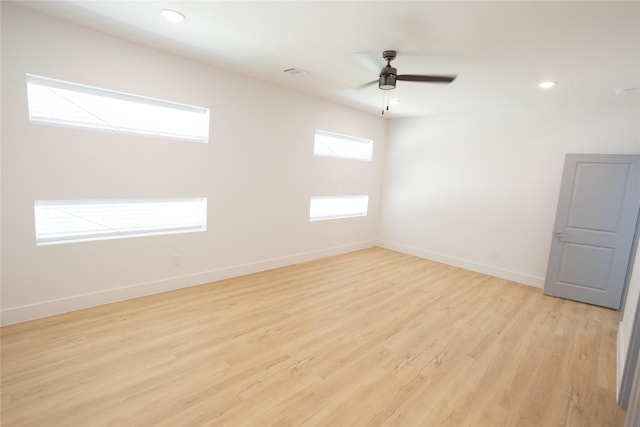 unfurnished room with recessed lighting, visible vents, a ceiling fan, baseboards, and light wood finished floors