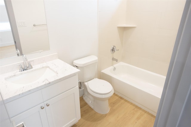 full bathroom with shower / bath combination, vanity, toilet, and wood finished floors