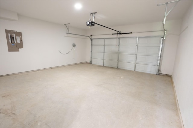 garage featuring a garage door opener and electric panel