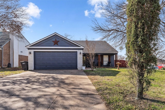 view of front facade featuring a garage, concrete driveway, and a front yard