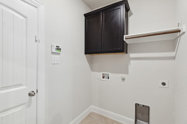 laundry area featuring cabinet space, baseboards, hookup for a gas dryer, hookup for a washing machine, and hookup for an electric dryer