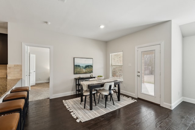 dining room with dark wood-style flooring and baseboards