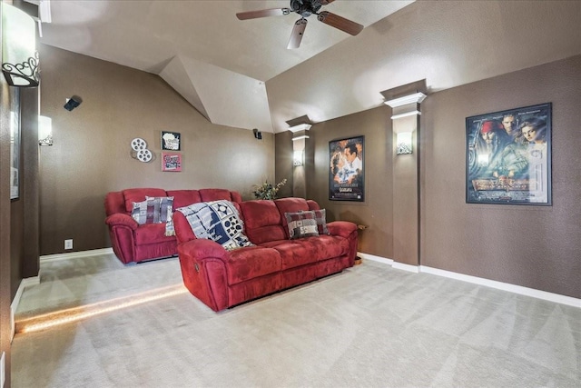 home theater featuring decorative columns, baseboards, ceiling fan, vaulted ceiling, and carpet flooring