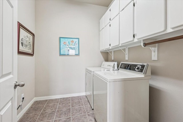 washroom with separate washer and dryer, light tile patterned flooring, cabinet space, and baseboards