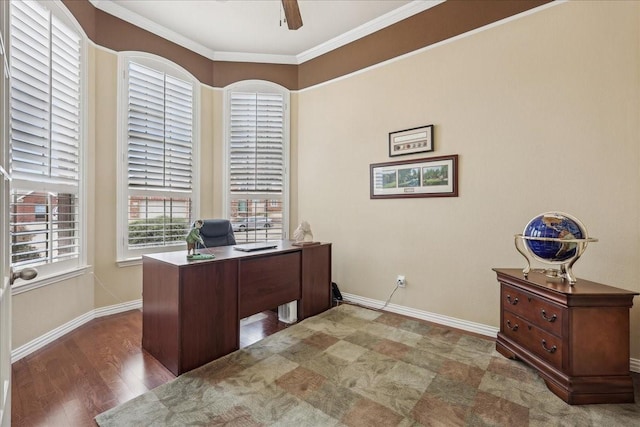 home office with baseboards, wood finished floors, a ceiling fan, and crown molding