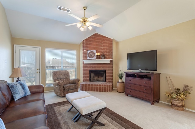 carpeted living area with visible vents, a ceiling fan, baseboards, a fireplace, and lofted ceiling