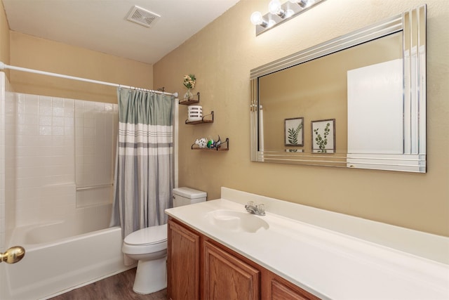 full bath featuring vanity, wood finished floors, shower / bathtub combination with curtain, visible vents, and toilet