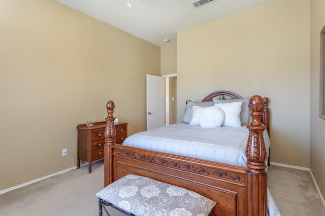 bedroom with visible vents, light colored carpet, and baseboards