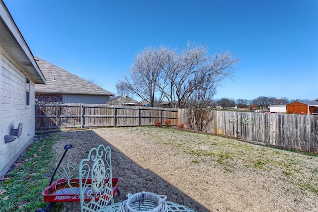 view of yard featuring a fenced backyard