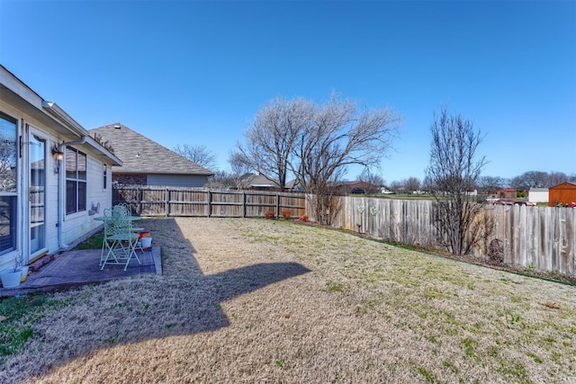 view of yard with a patio and a fenced backyard