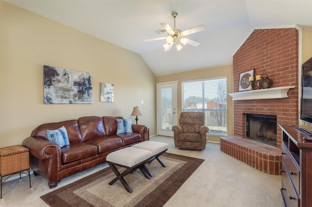 carpeted living area featuring a brick fireplace, ceiling fan, and vaulted ceiling