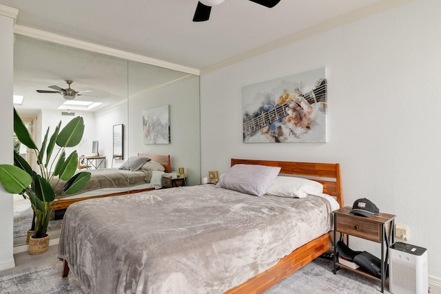 bedroom featuring a ceiling fan and crown molding