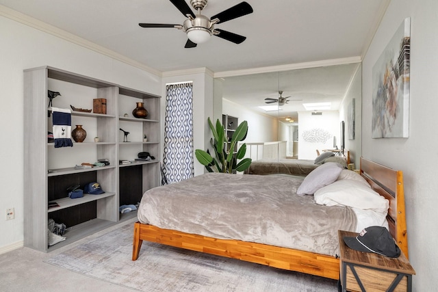 bedroom featuring ceiling fan, carpet floors, and ornamental molding