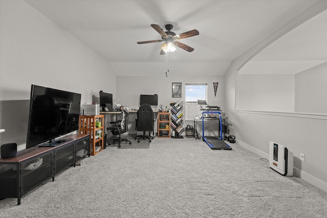 carpeted office with vaulted ceiling, ceiling fan, and baseboards