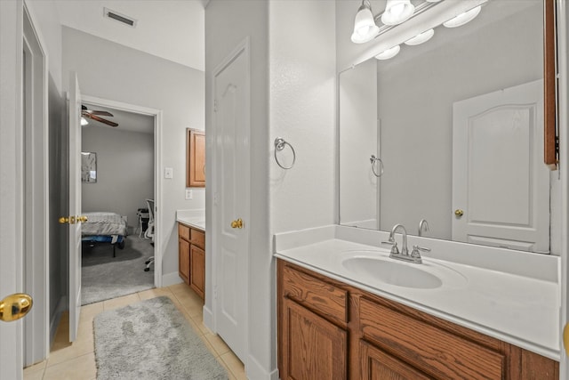 bathroom with visible vents, ensuite bath, tile patterned flooring, and vanity