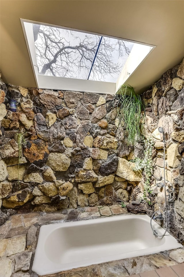 bathroom featuring a bath