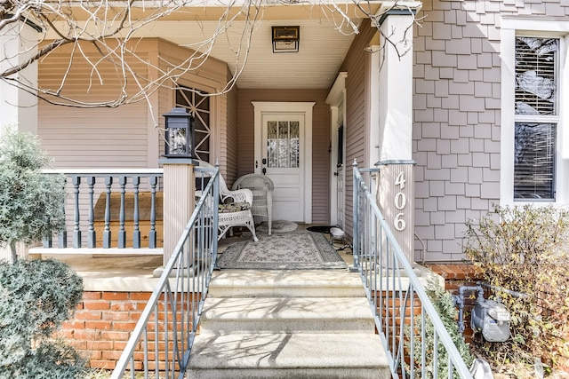 property entrance featuring a porch