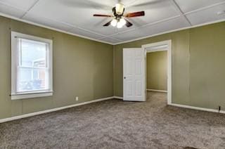 spare room featuring carpet floors, ceiling fan, and baseboards