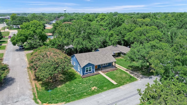 bird's eye view featuring a wooded view