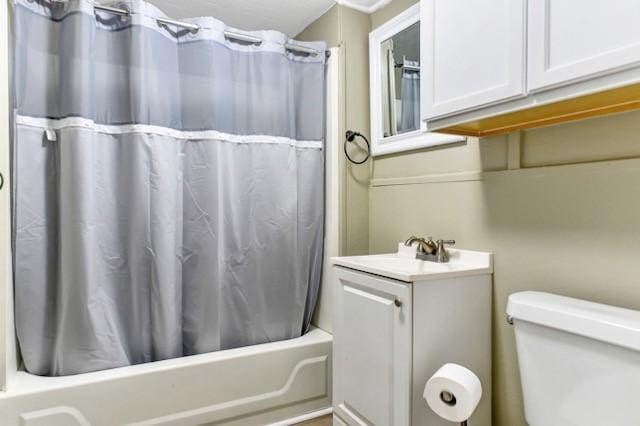 bathroom featuring vanity, toilet, and shower / bathtub combination with curtain