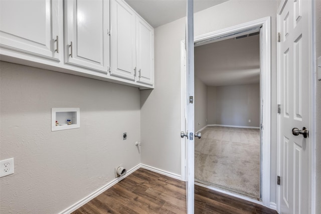 washroom with washer hookup, cabinet space, electric dryer hookup, and baseboards