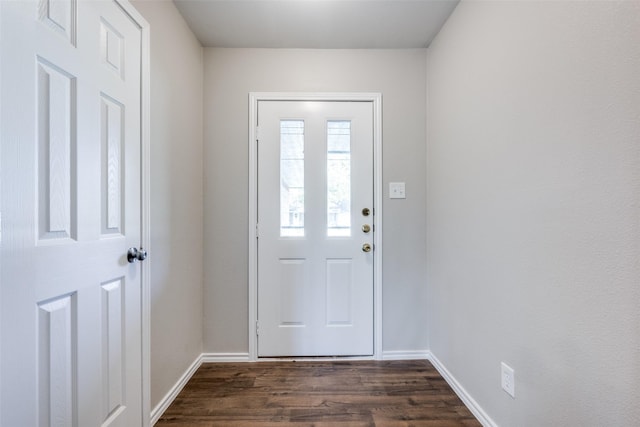 entryway featuring dark wood-style flooring and baseboards