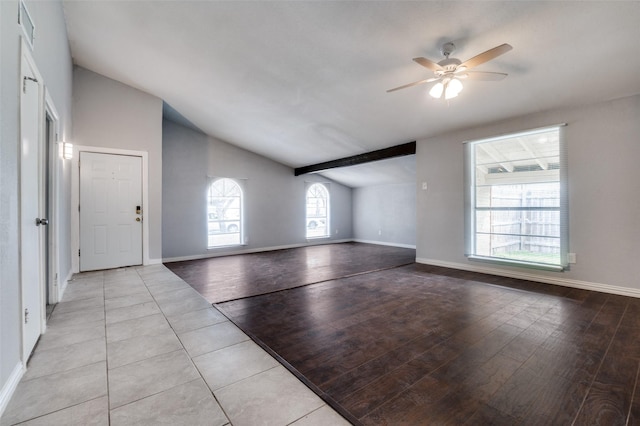 unfurnished living room featuring light wood-type flooring, lofted ceiling, ceiling fan, and baseboards