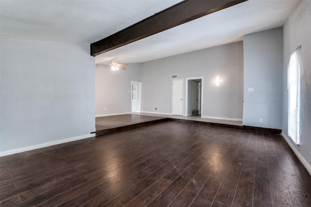 empty room featuring a wealth of natural light, ceiling fan, baseboards, and wood finished floors