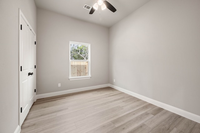 unfurnished bedroom with light wood finished floors, visible vents, baseboards, and a ceiling fan