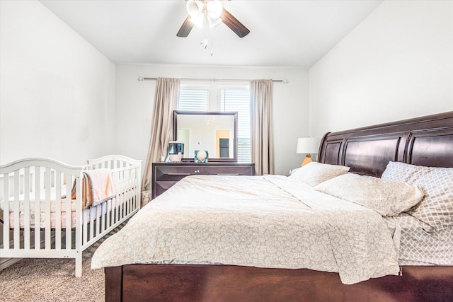 carpeted bedroom with a ceiling fan