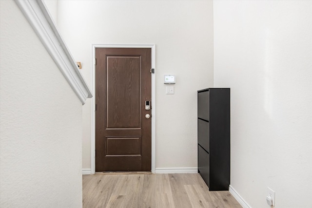 interior space with light wood-type flooring and baseboards