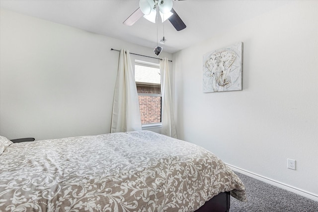 carpeted bedroom featuring a ceiling fan and baseboards